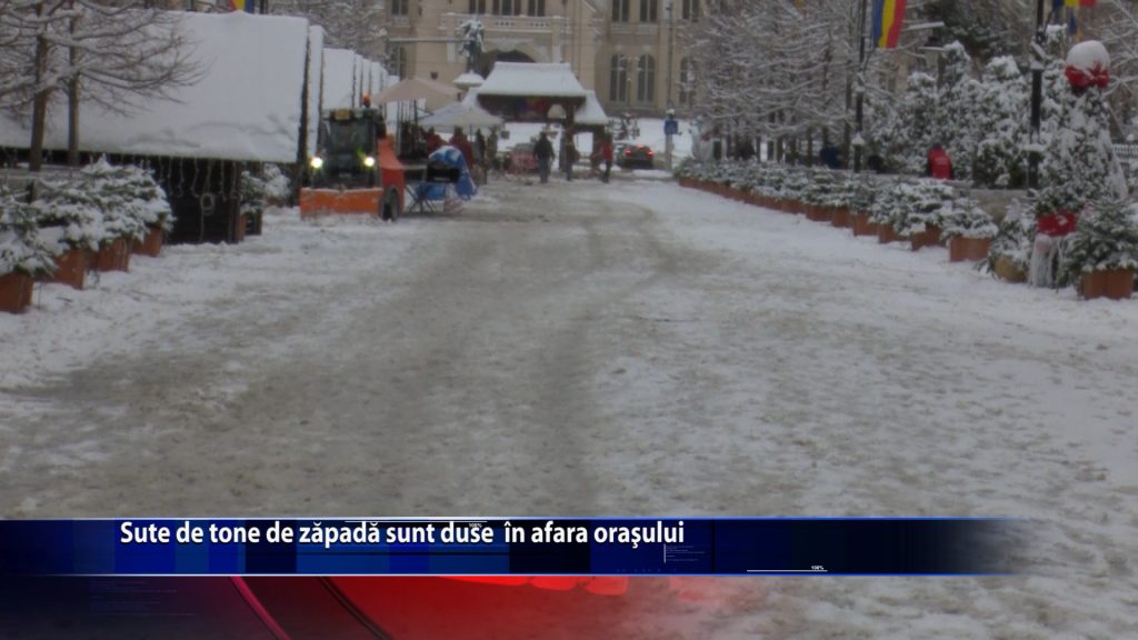 Sute de tone de zapada sunt duse in afara orasului