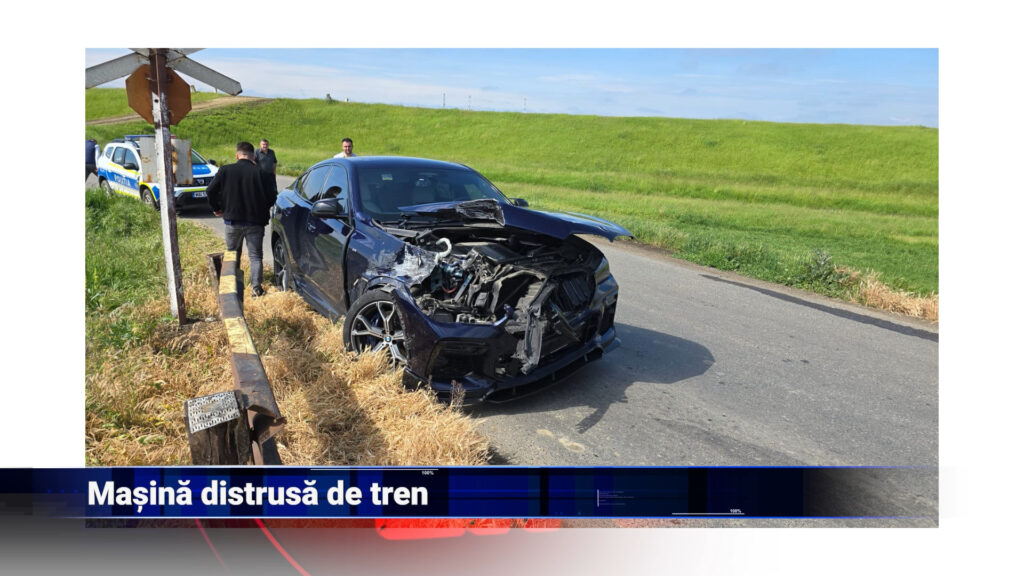 Mașină distrusă de tren